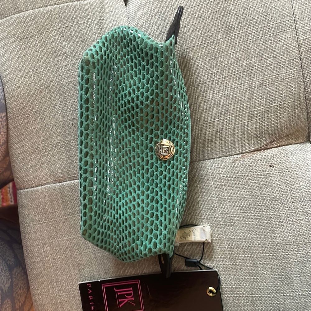 NWT: 7 x 4 inches . Can hold change, cosmetics, etc.